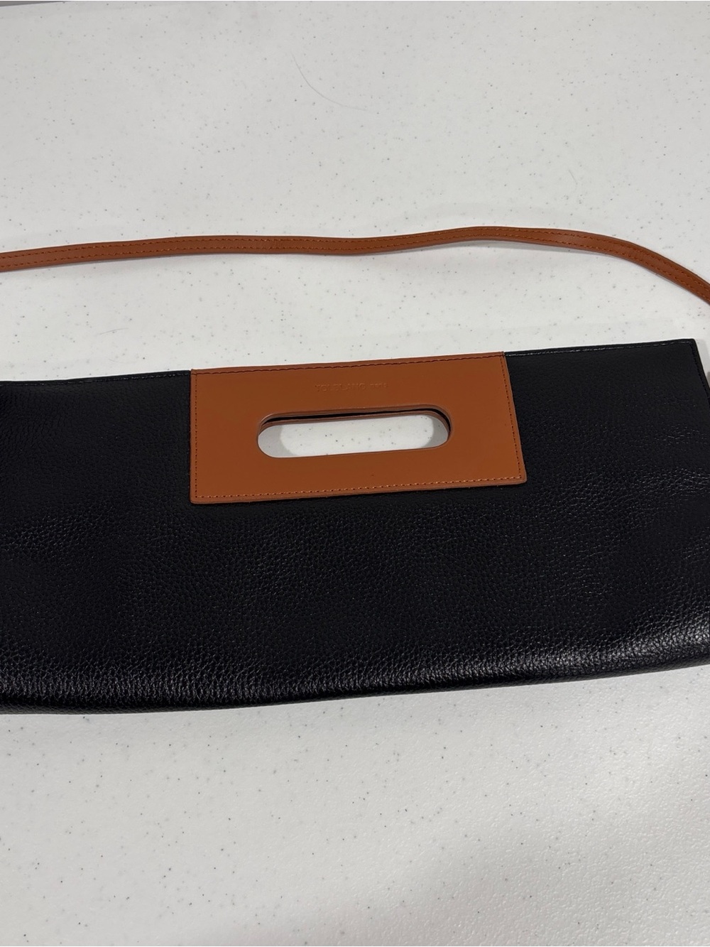 Two-Tone Black and Tan Leather Clutch with Cutout Handle. Never used.